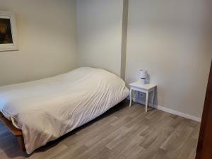 Posteľ alebo postele v izbe v ubytovaní Le garage