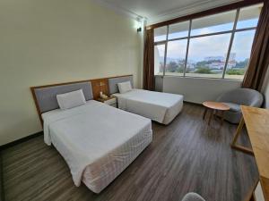 Postel nebo postele na pokoji v ubytování Sammy Hotel