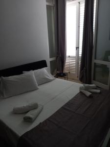 Postel nebo postele na pokoji v ubytování Dentro a un Sogno