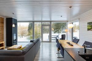 a living room with a couch and a table at 2 Personen mit Sauna F3H7 in Ruhla