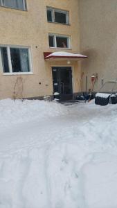 a pile of snow in front of a building at Arctic Landhaus in Sotkamo
