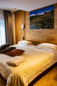 Postel nebo postele na pokoji v ubytování Hotel Dufour