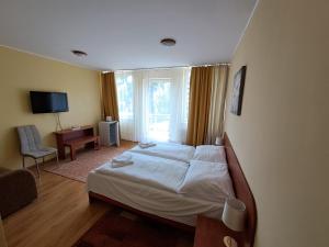 Posteľ alebo postele v izbe v ubytovaní Penzion Zornicka