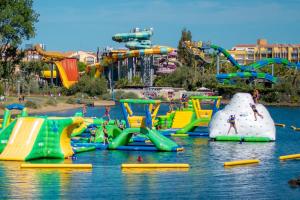 a water park with a bunch of slides in the water at Appartement avec terrasse in Le Grau-dʼAgde