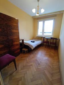 Posteľ alebo postele v izbe v ubytovaní Apartament Krynica