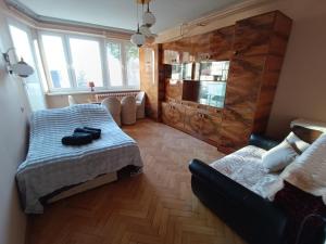 Posteľ alebo postele v izbe v ubytovaní Apartament Krynica