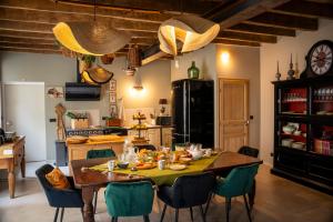 a kitchen with a table with food on it at Dépendance maison bourgeoise in Grand-Fougeray