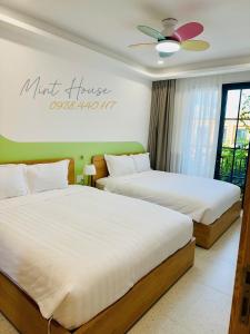 Ένα ή περισσότερα κρεβάτια σε δωμάτιο στο Novaword Phan Thiết