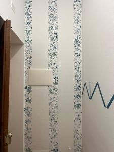 a chart on the wall of a bathroom with a graph at Spinuzza relax in Cefalù