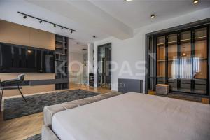 a living room with a couch and a table at Presidental Suite in Luxury Hotel at City Center in Pristina