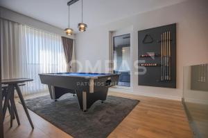 a living room with a pool table in it at Presidental Suite in Luxury Hotel at City Center in Pristina