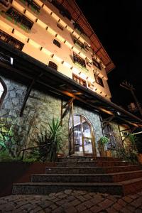 a building with stairs in front of a building at Hotel Blumenhof in Blumenau