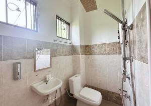 a bathroom with a toilet and a sink at Bangi BungalowStay in Kajang +20 photos