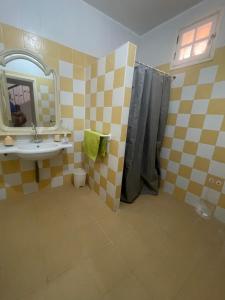 a bathroom with a sink and a mirror at Villa Saidia in Saidia  +12 photos