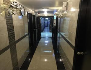 a hallway in a building with a long corridor at Hi-Inn in Hong Kong