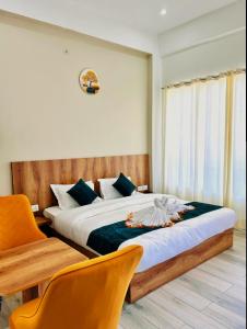 Postel nebo postele na pokoji v ubytování Hotel royal town