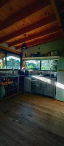 a kitchen with a sink and a stove at Coruya Wild in Santa Ana