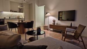 a living room with a couch and a table at ONNE Apartment in Zaprešić