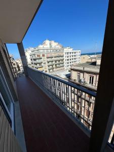 a balcony with a view of a city at Luxury Melo Apartment in Bari