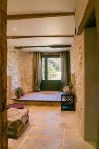 Katil atau katil-katil dalam bilik di Gîte Mas de Boulègue