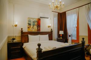Ένα ή περισσότερα κρεβάτια σε δωμάτιο στο Leila Mansion Hotel
