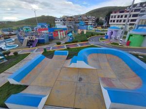 a skate park with a skateboard ramp in a city at Residencia en Gourmancia - Estancia & Sabor in Puno