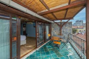a balcony with a view of a bedroom at TaksimAntiqueOtel in Istanbul