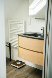 a kitchen with a sink and a wooden counter at Evasion familiale à la plage in Trégastel +49 photos