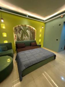 a bedroom with a large bed and a couch at Leisure homes in Lucknow