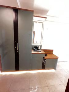 a room with a desk with a window and a window at Leisure homes in Lucknow