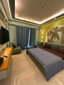 a bedroom with a bed and a desk and a tv at Leisure homes in Lucknow +20 photos