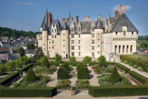 a castle with a garden in front of it at Tiny house sous le chene in Saint-Roch