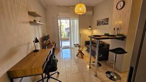 a living room with a table and a bar in it at OLD TOWN 58a in Xanthi +2 photos