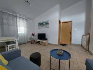 TV a/nebo společenská místnost v ubytování Apartment Dario