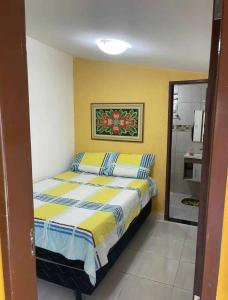 a small bedroom with a bed and a bathroom at Temporada2 in Olinda +20 photos