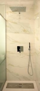 a shower in a bathroom with a glass door at Marco 4 Seasons- Winter in Arco da Calheta +15 photos