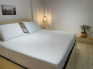 Postel nebo postele na pokoji v ubytování FOTEINI RESIDENCE