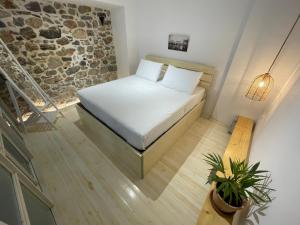 Postel nebo postele na pokoji v ubytování FOTEINI RESIDENCE