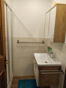 a bathroom with a sink and a mirror at Ferienhaus Schmid in Serfaus +99 photos