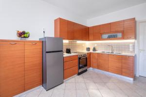 Kuchyň nebo kuchyňský kout v ubytování Plumeria Apartment Sitia