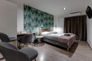 Postel nebo postele na pokoji v ubytování VV hotel & apartments