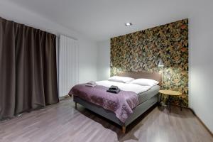 Postel nebo postele na pokoji v ubytování VV hotel & apartments
