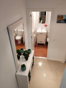 a bathroom with a sink and a mirror at Armonía y tranquilidad habitaciones in Albacete +104 photos