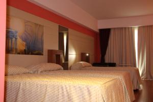 Postel nebo postele na pokoji v ubytování Catania International Airport Hotel