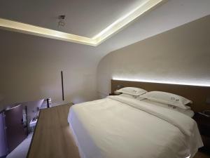 Letto o letti in una camera di Sanqiu Designer B&B