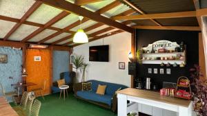 a living room with a blue couch and a table at Limon Hotel in Edirne