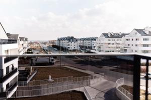 a view of a city from a balcony at GOLDEN HAUS Opole - SkyLOFT & MiniLOFT in Opole