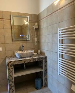 a bathroom with a sink and a mirror at residence u filipaghju in Galeria +35 photos