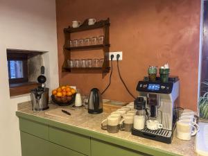 a kitchen with a coffee maker on a counter at Maison Belles Pierres in Montagny-lès-Beaune