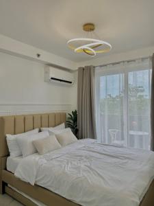 Ένα ή περισσότερα κρεβάτια σε δωμάτιο στο E&K Staycation